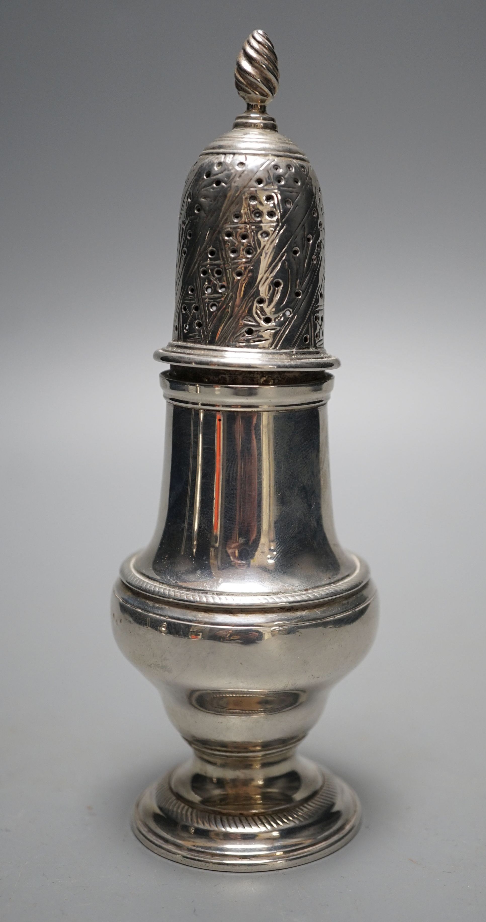 An early George III silver pepper, with interior cap with finial, by John Delmester, London, 1760, 15.5cm, 4.5oz.